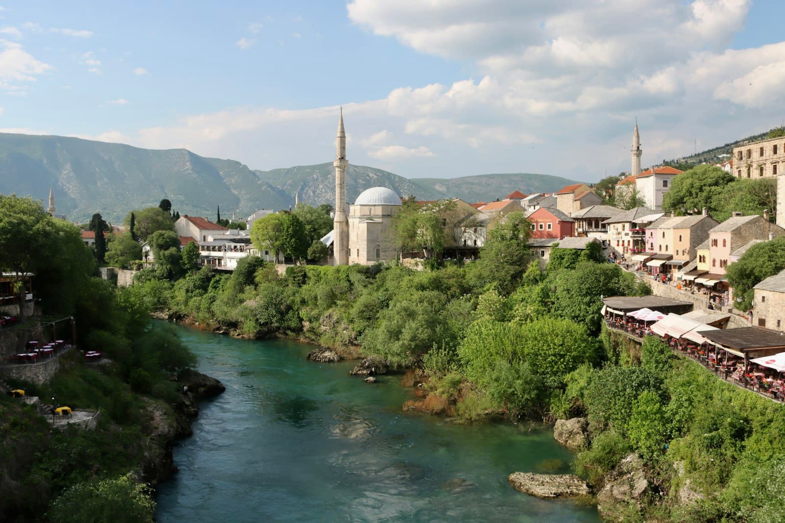 Jajce — a river running through a lush green hillside