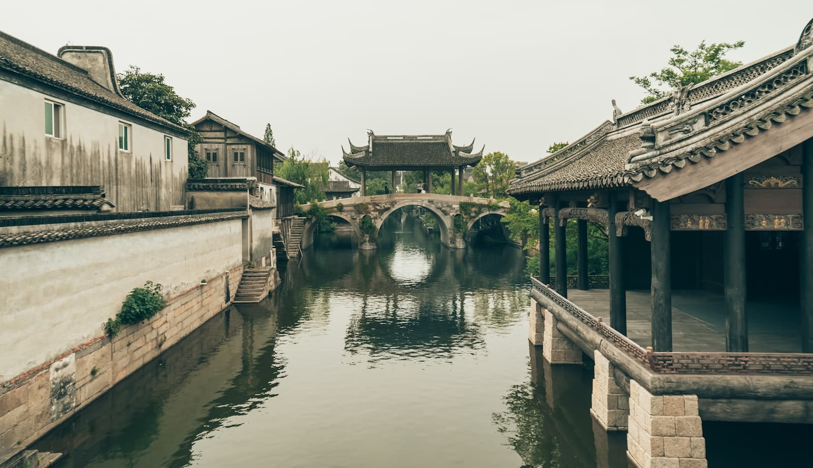 Jiaxing (Nanhu) — a river running through a village with a bridge