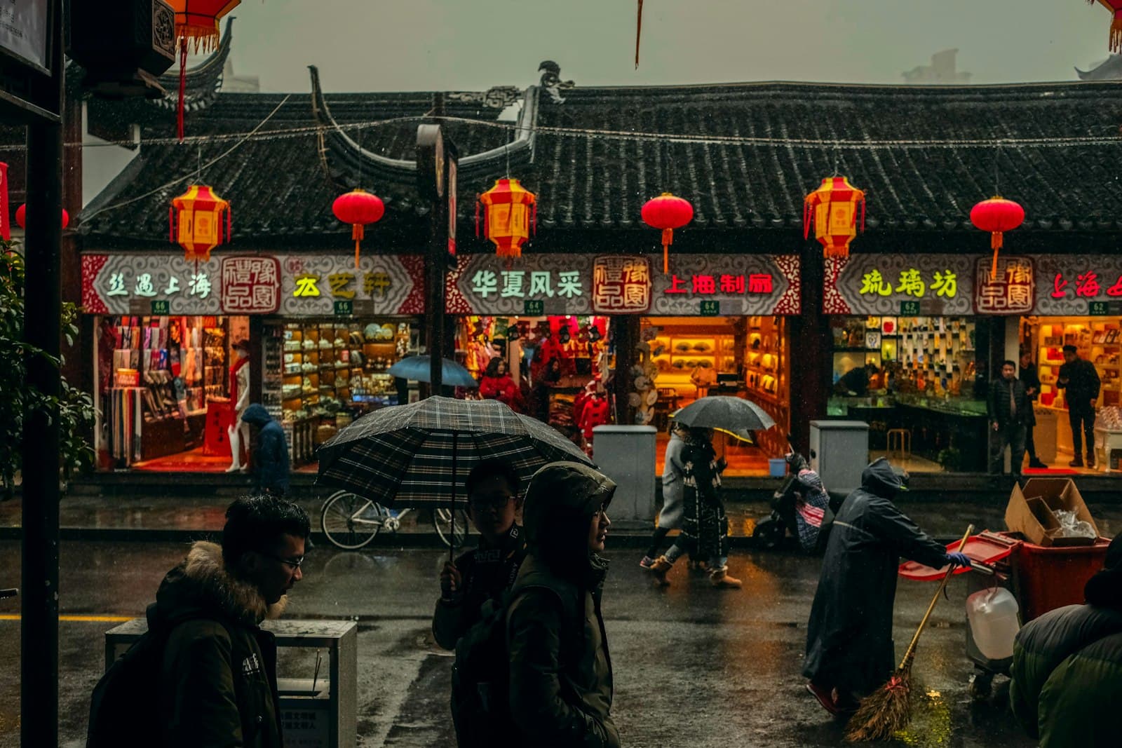 Jinan — person carrying umbrellas
