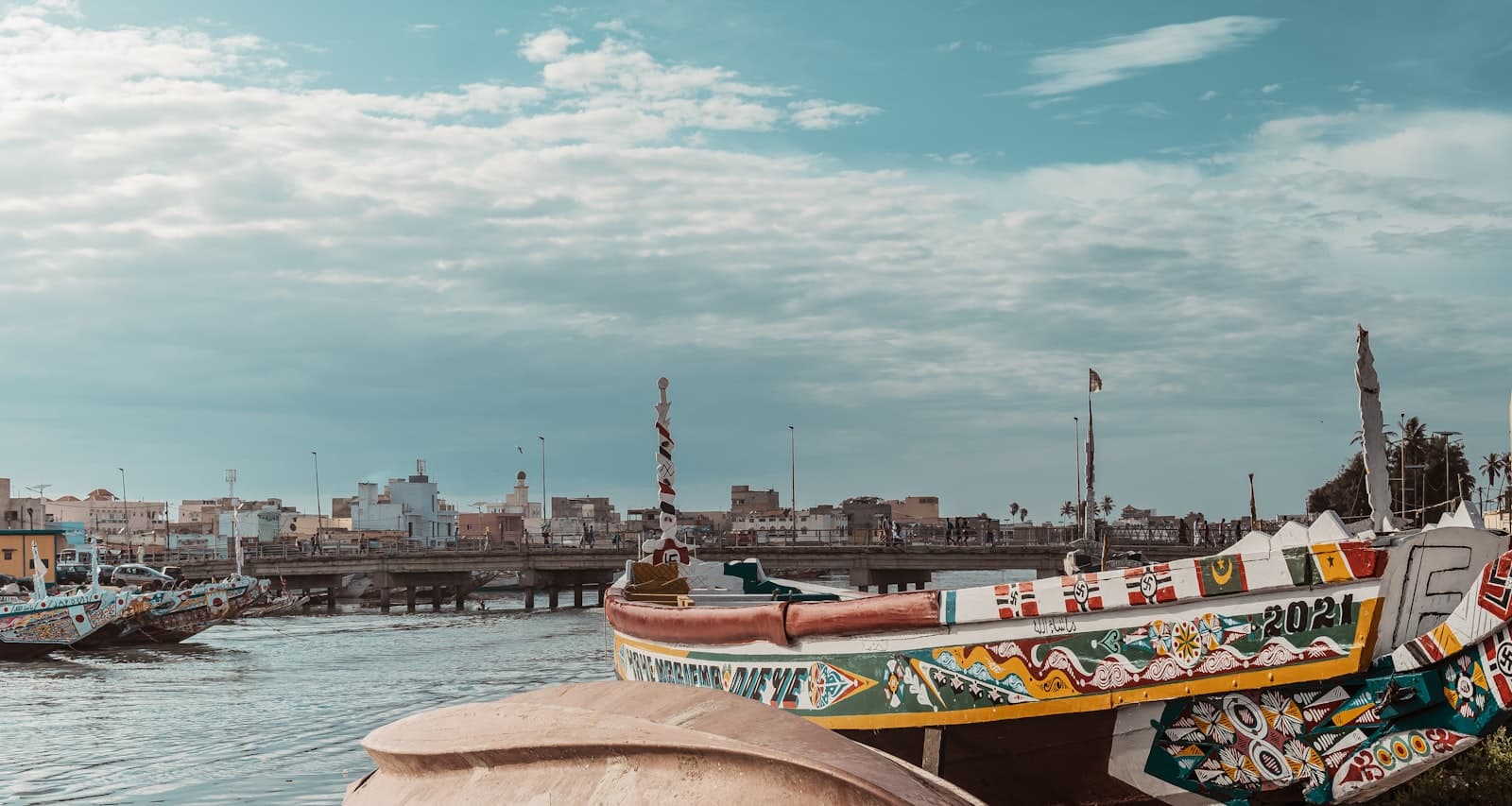 Joal-Fadiouth — brown and white boat on water during daytime