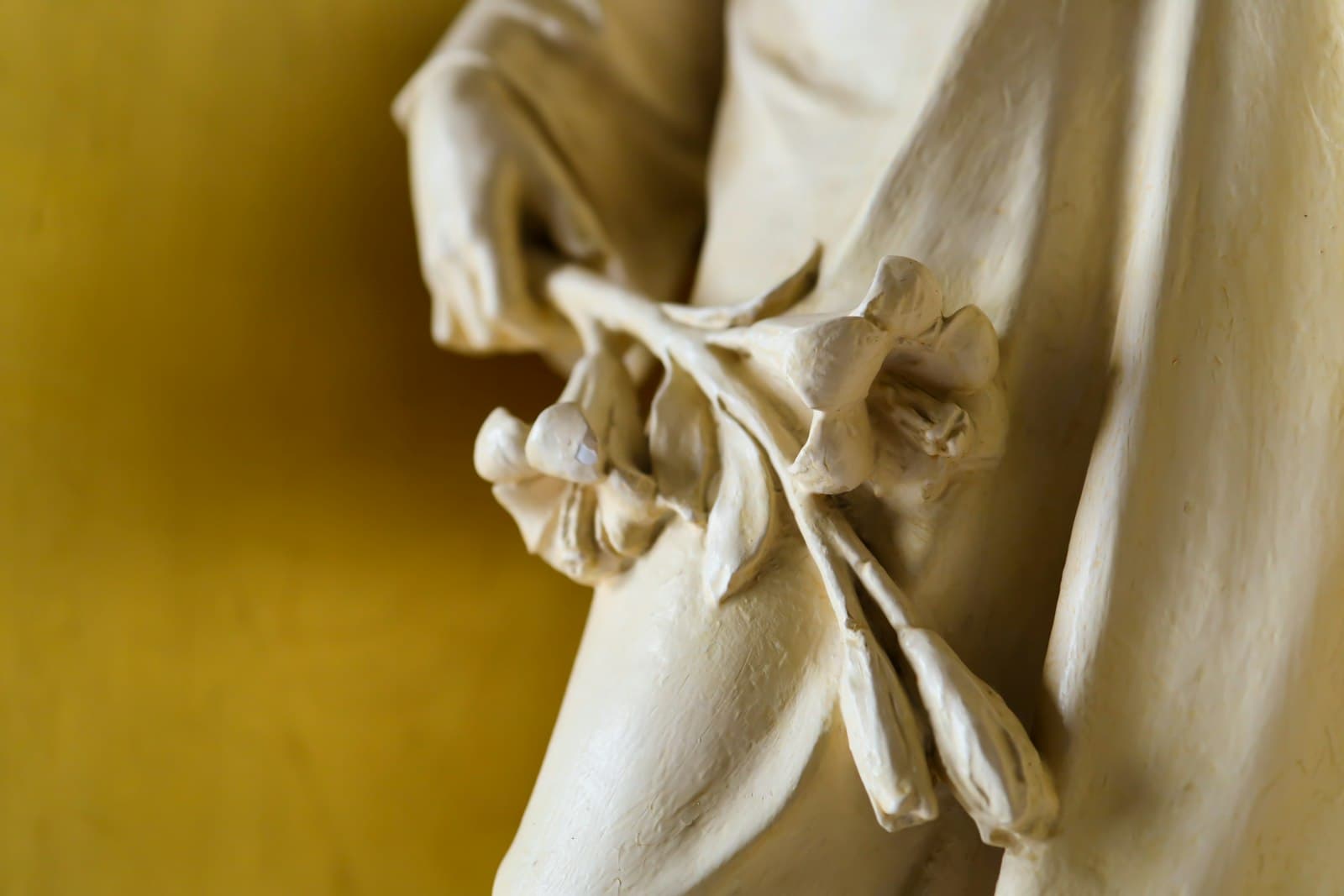 Joseph — white angel statue in grayscale photography