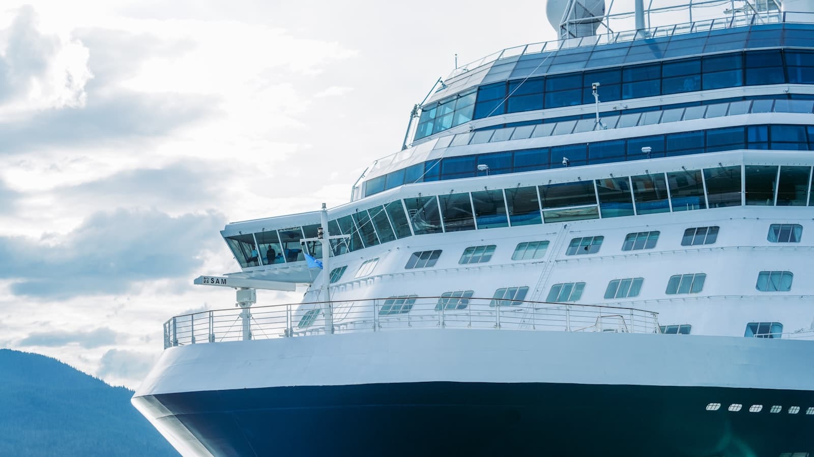 Juneau — A large cruise ship in the water with mountains in the background