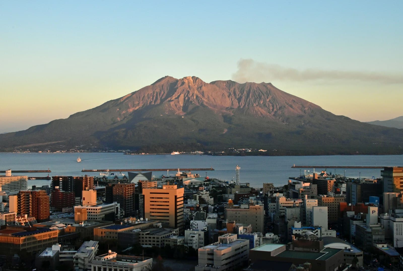 Kagoshima — a view of a city with a mountain in the background