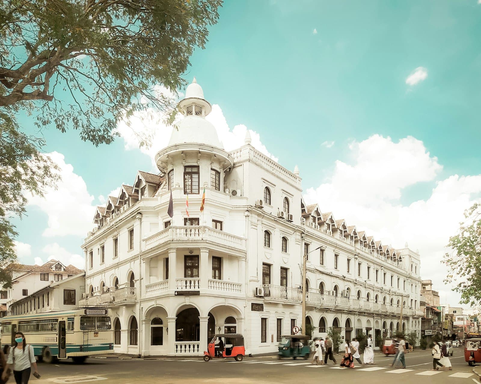 Kandy — a large white building with a bus parked in front of it