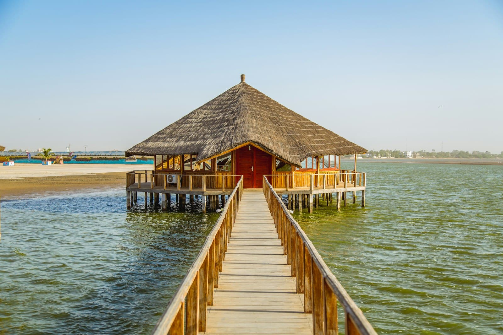 Kaolack — brown wooden shed surrounded body of water