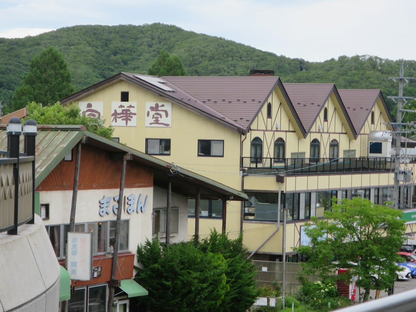 Karuizawa — A view of a town with a mountain in the background