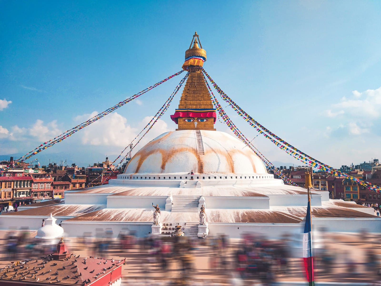 Kathmandu — white and gold concrete building under blue sky during daytime