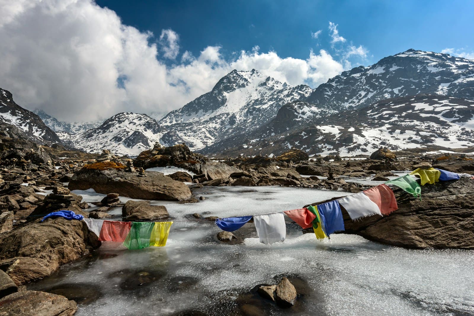 Kathmandu — assorted-color of apparel hanged below creek across glacier mountain