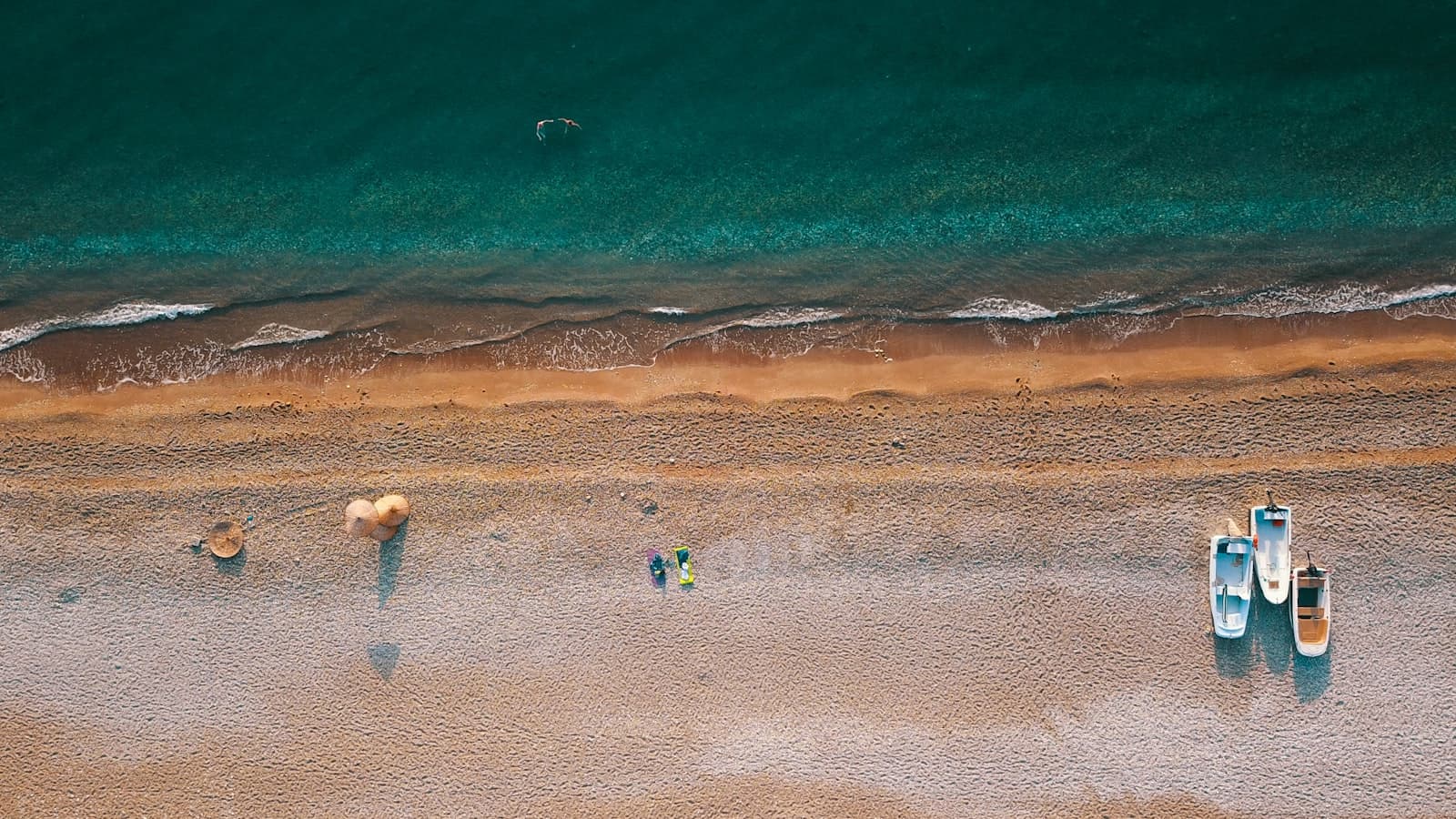 Kemer — aerial photography of three boats parked on shore