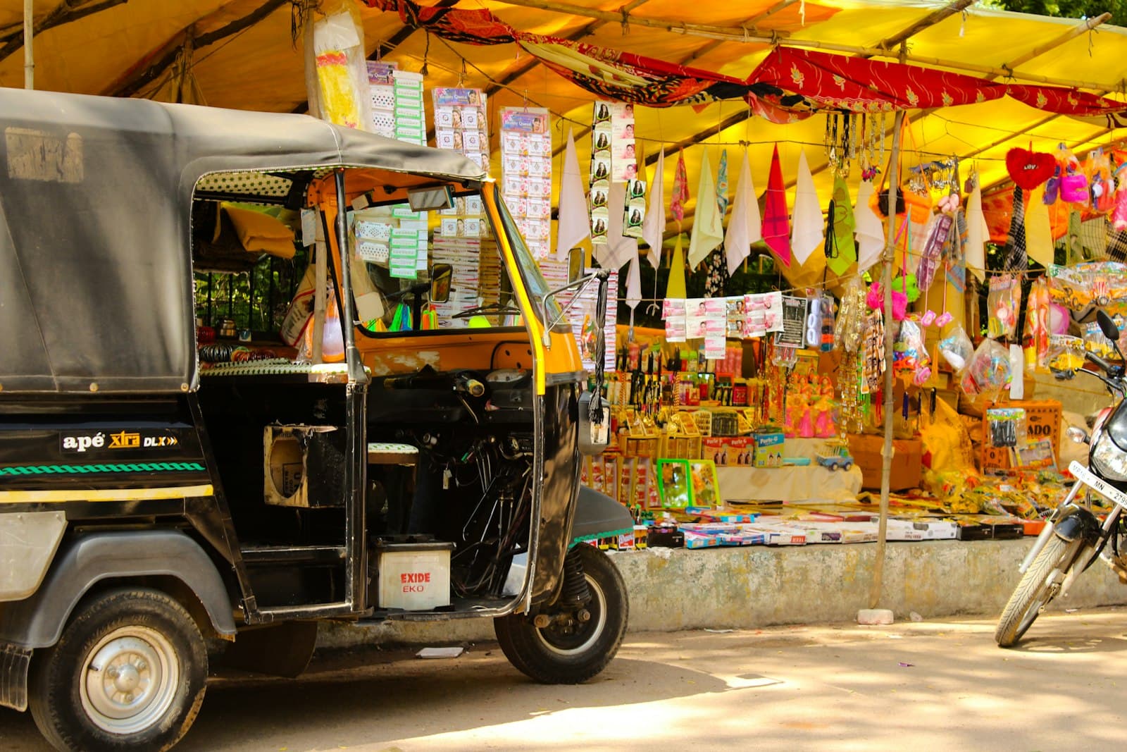 Khajuraho — black auto rickshaw on road during daytime