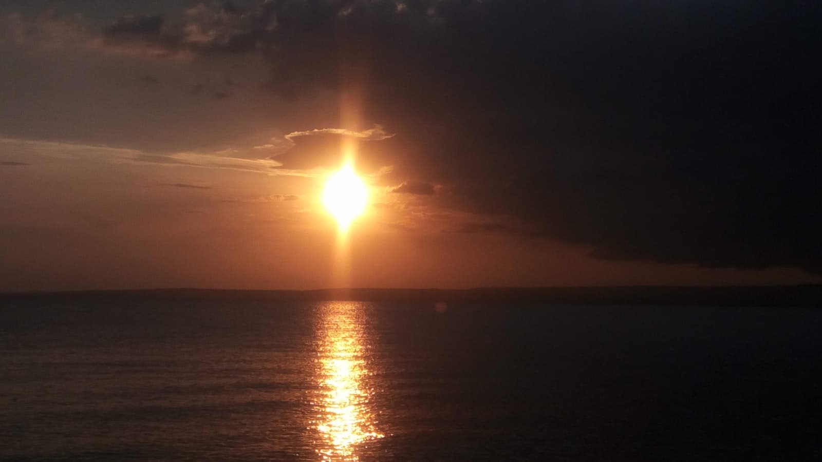 Kisumu — sun setting over the sea