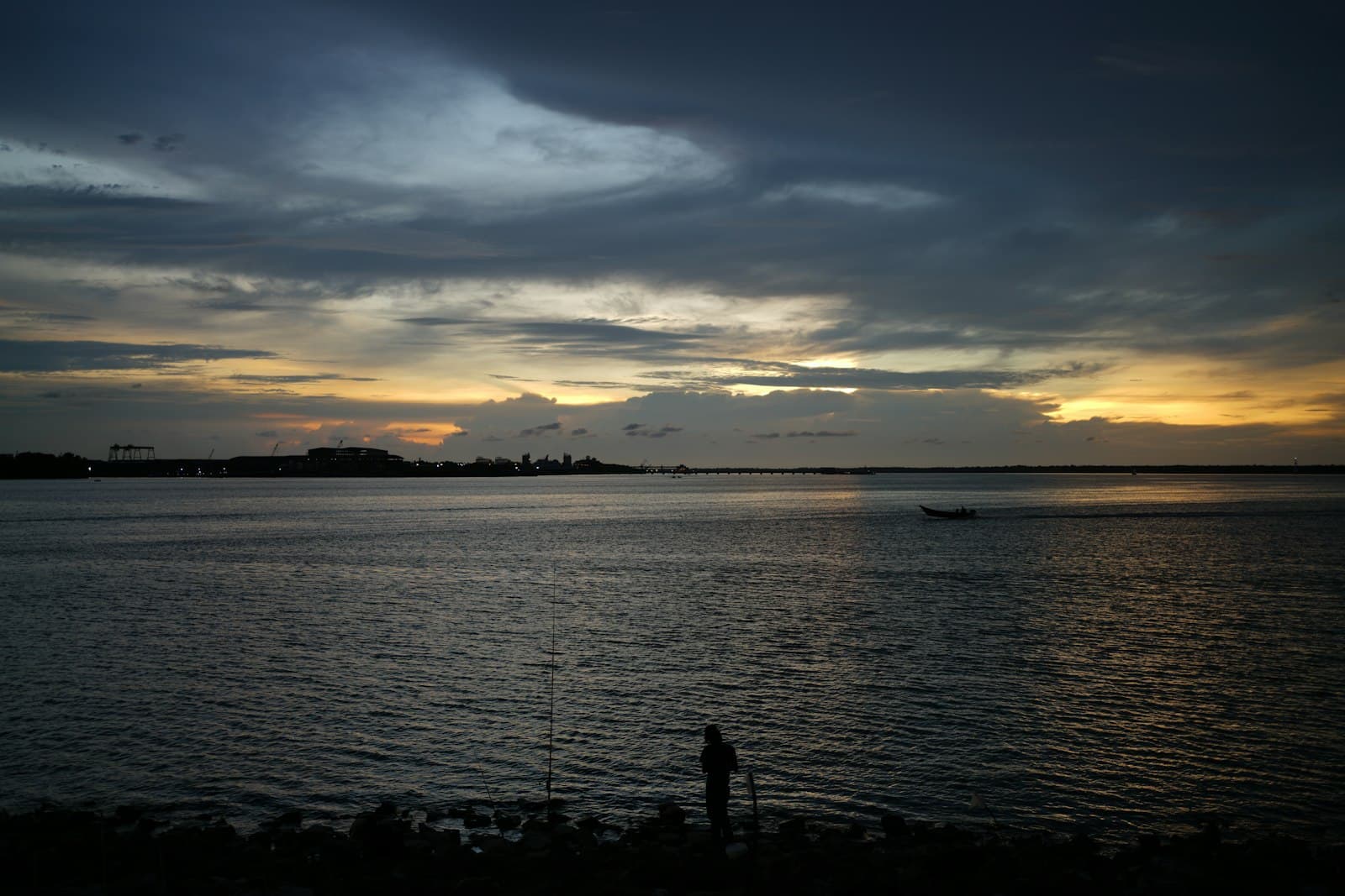 Klang — a body of water with a boat in the distance