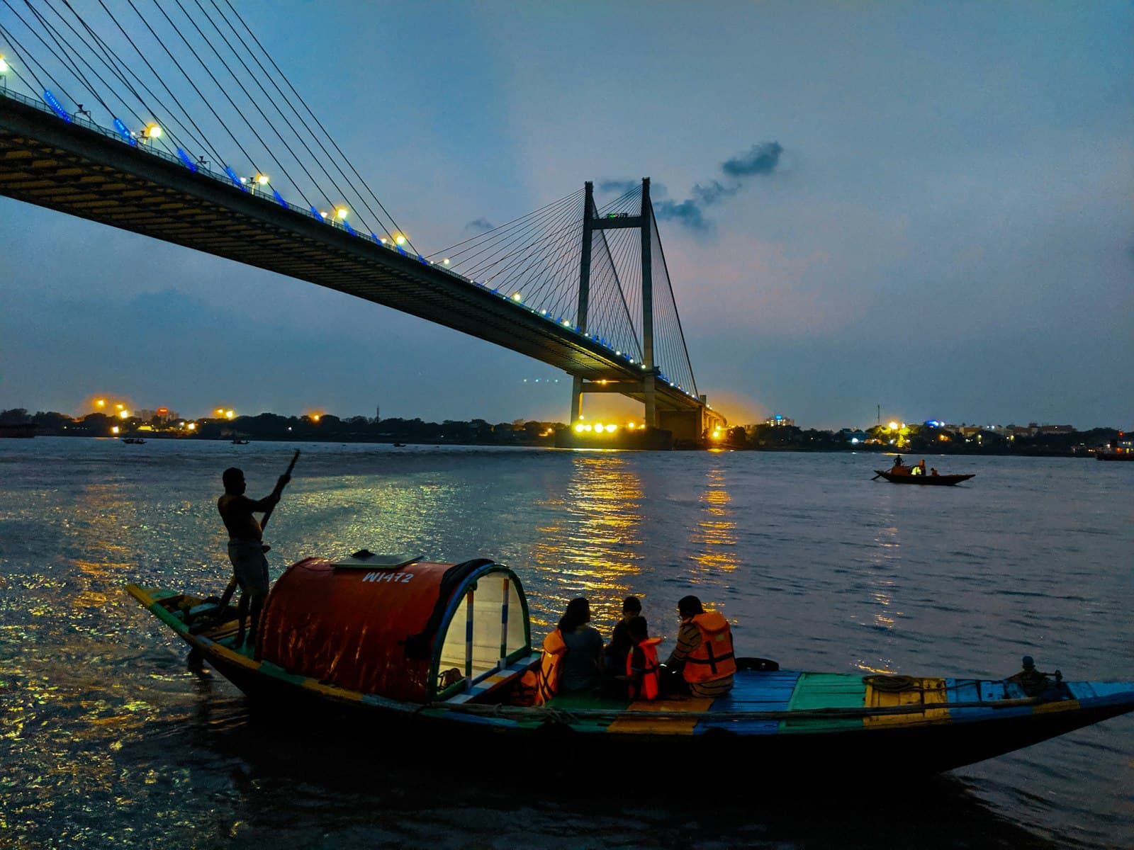 Kolkata — people riding boat on body of water during daytime