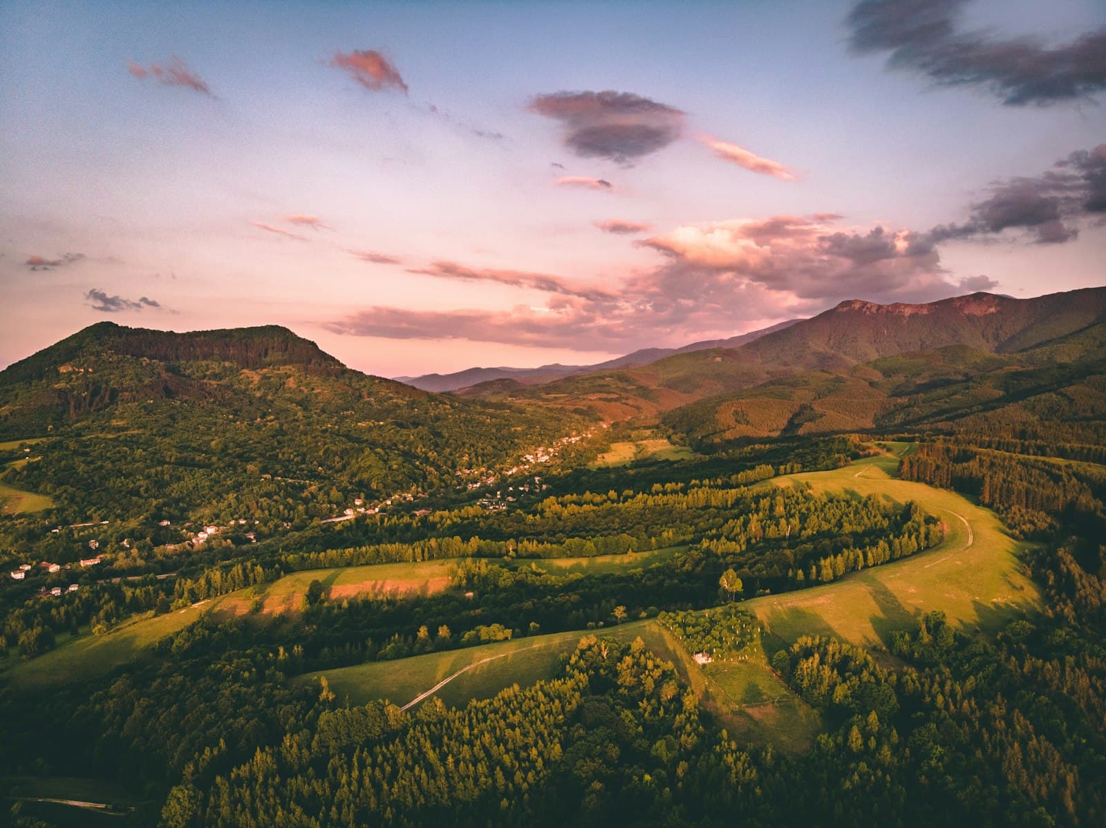 Koprivshtitsa — green trees and mountains under cloudy sky during daytime