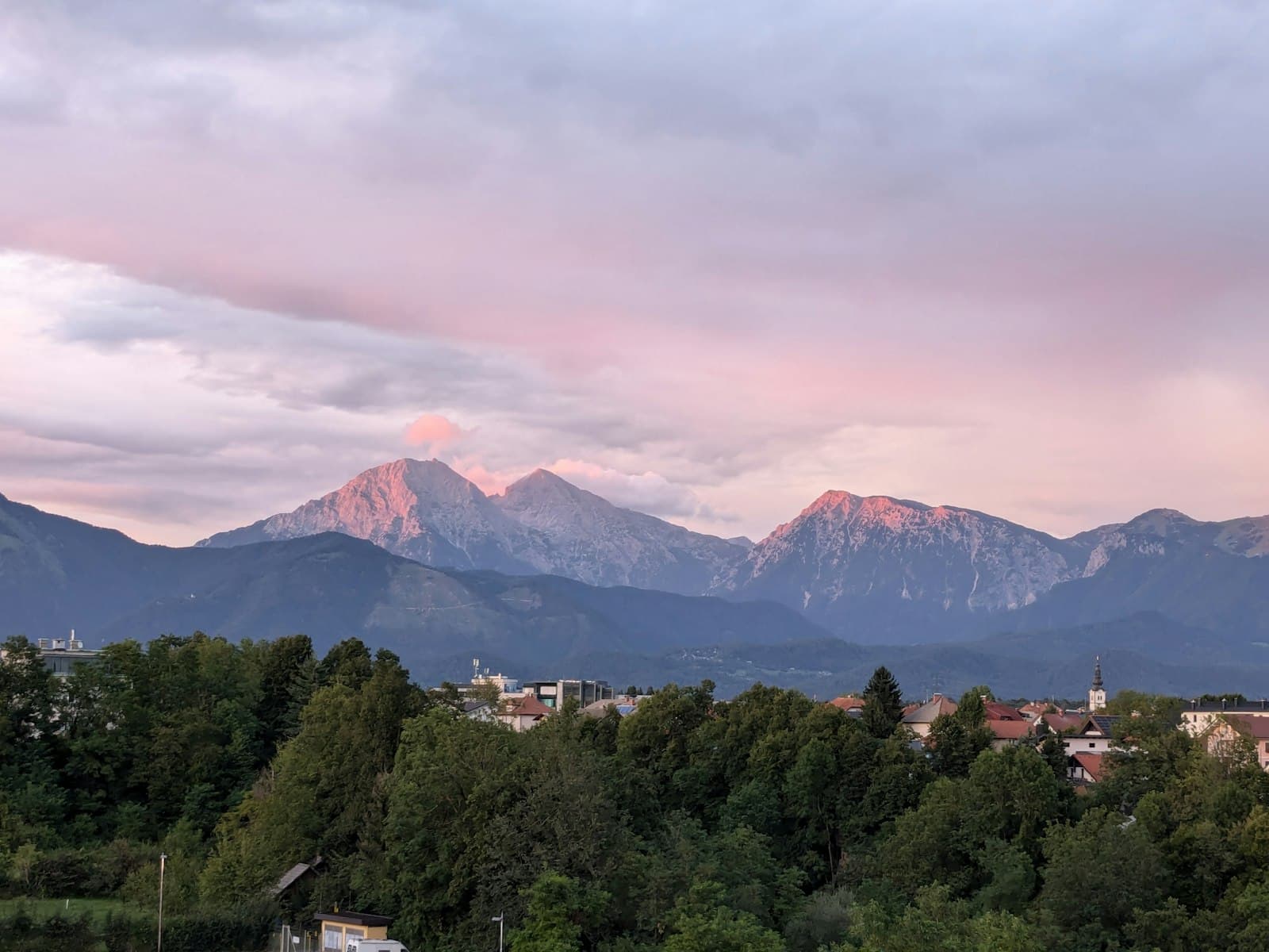 Kranj — A view of a city with mountains in the background