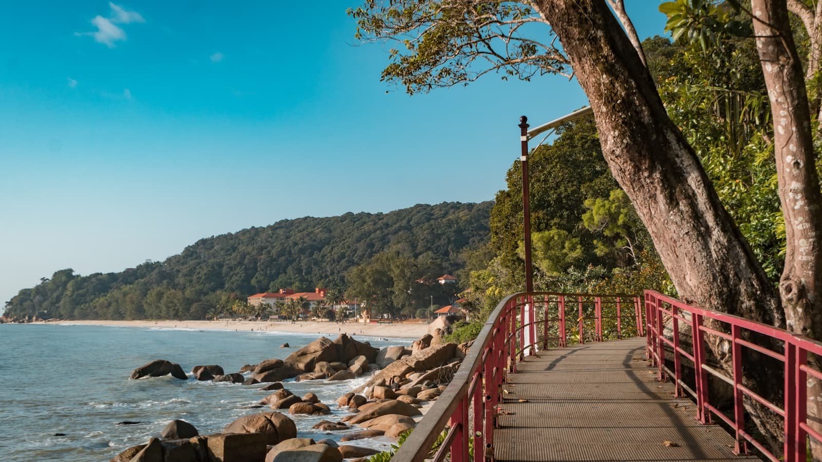 Kuantan — brown wooden bridge over the sea during daytime