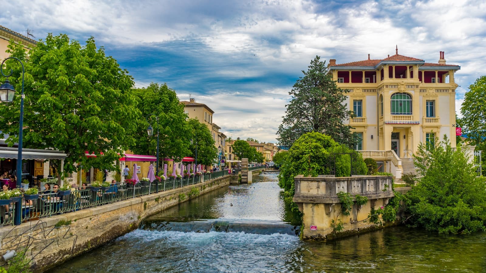 L'Isle-sur-la-Sorgue — people walking on bridge over river during daytime