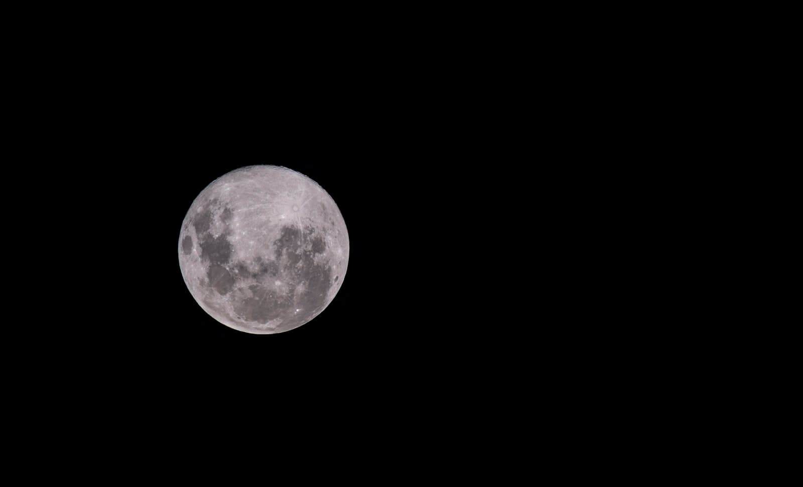 La Plata — a full moon is seen in the dark sky