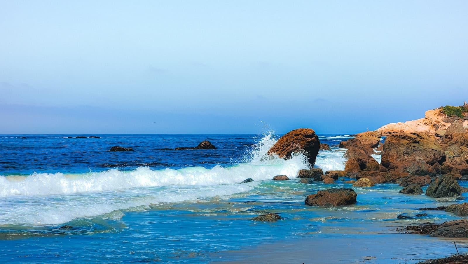 Laguna Beach — A rocky beach with waves crashing against the rocks