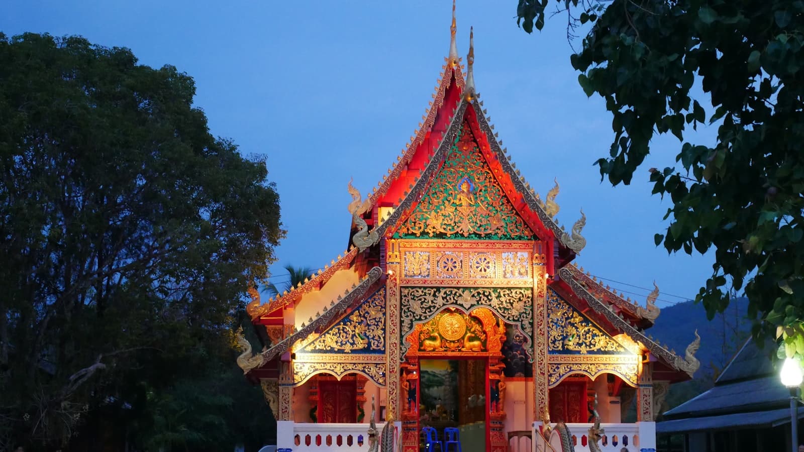 Lampang — a building that has a clock on the front of it