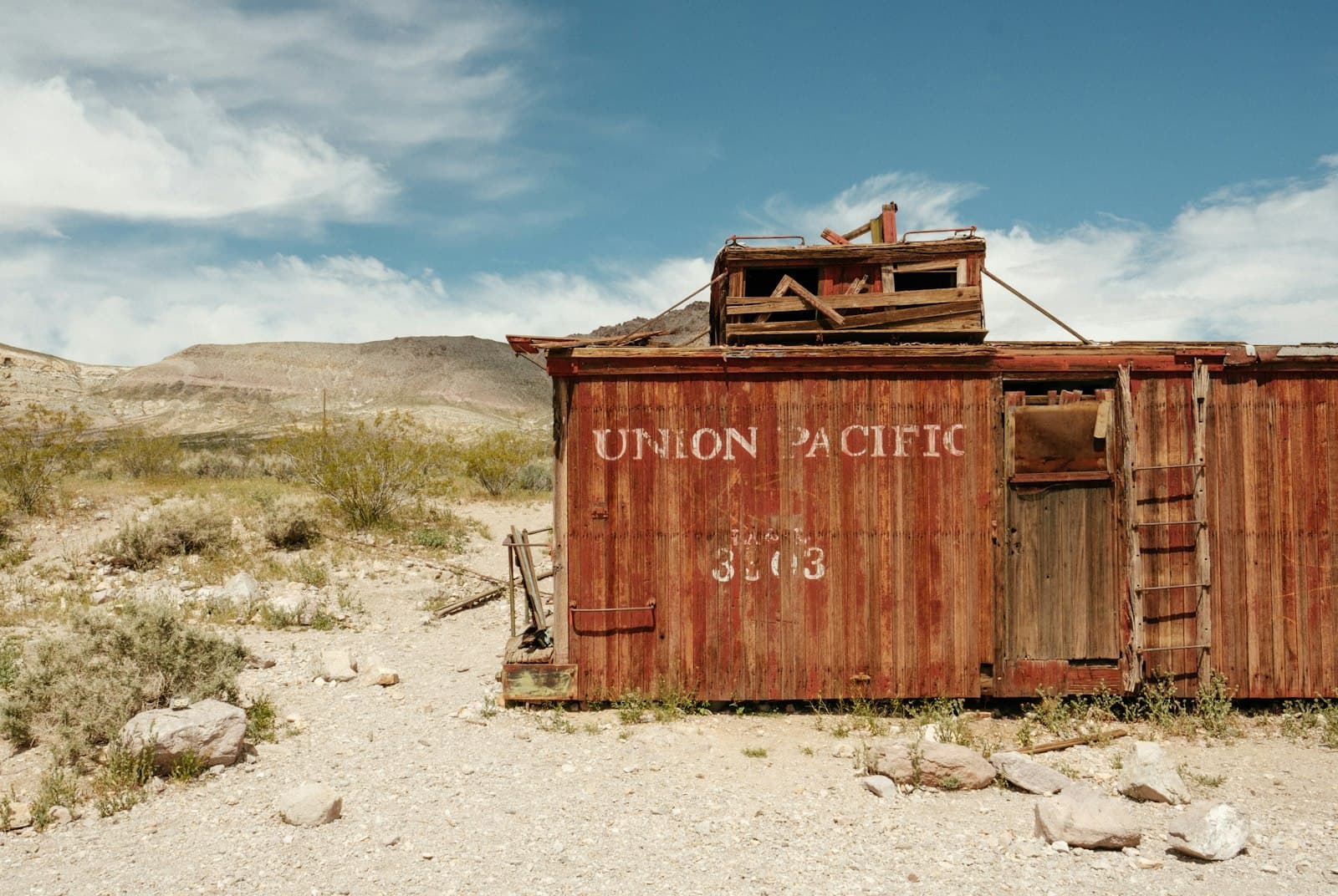 Lander — brown dilapidated Union Pacific train car at desert