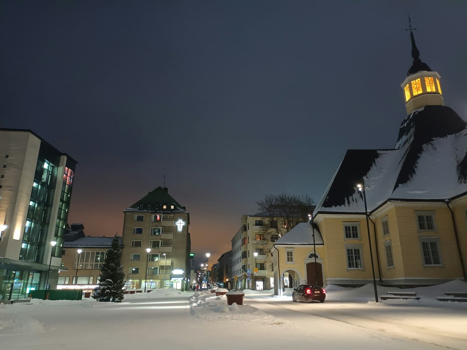 Lappeenranta — a snowy street with buildings and a clock tower in the background