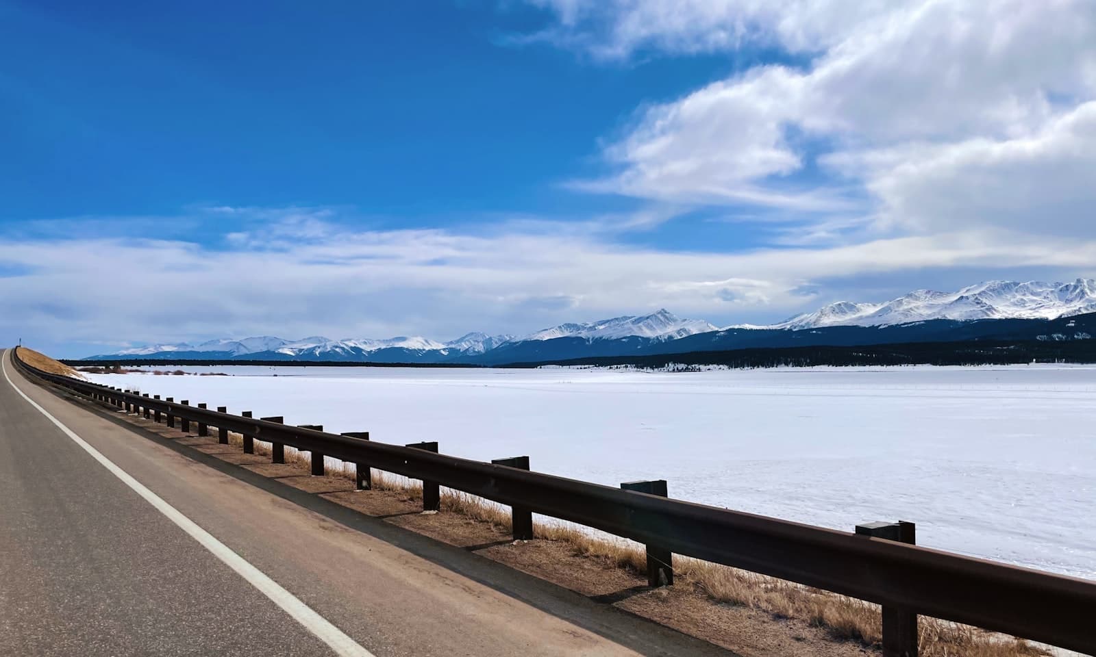 Leadville — gray wooden dock on body of water under blue sky during daytime