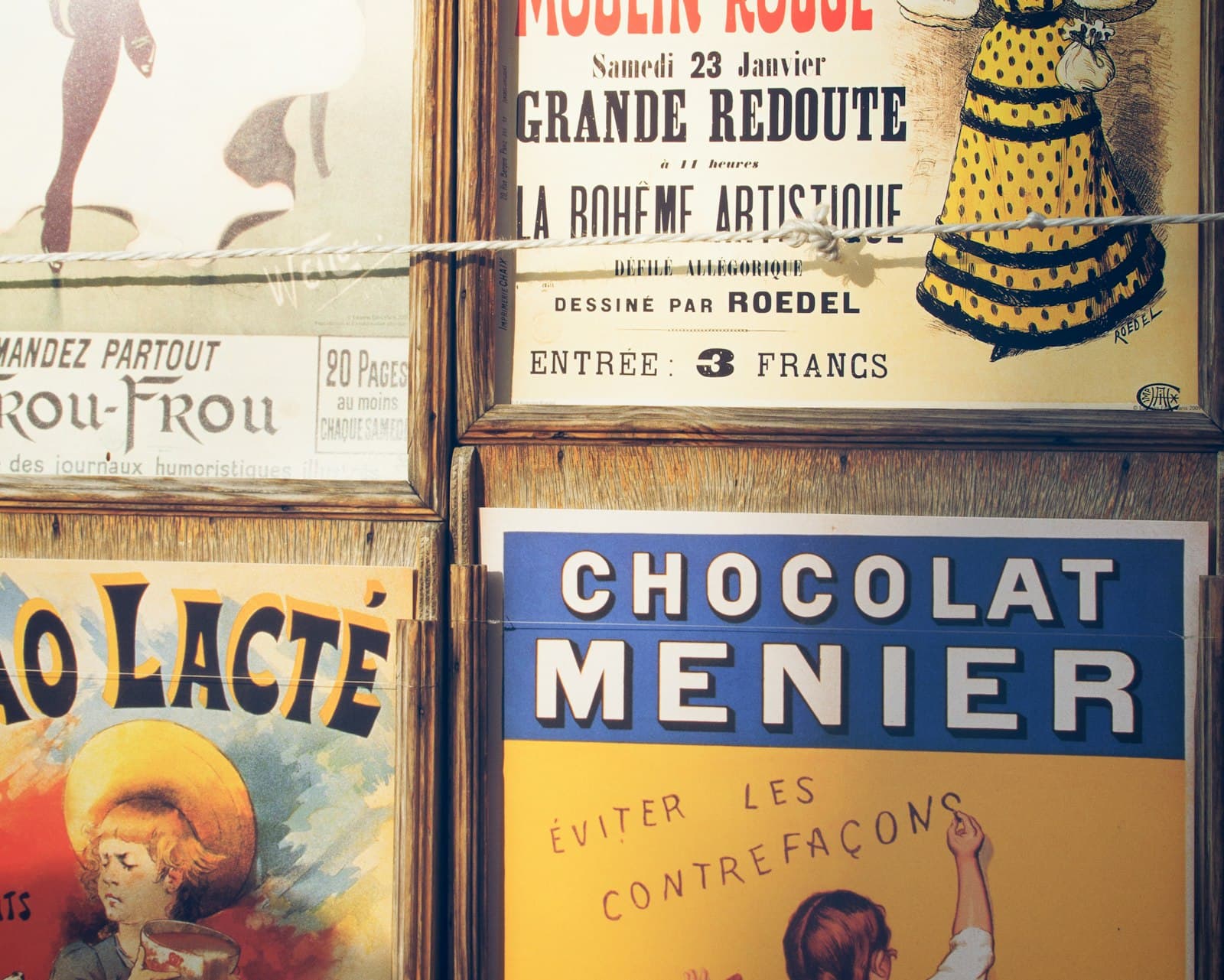 Lectoure — a bunch of posters on the wall of a building