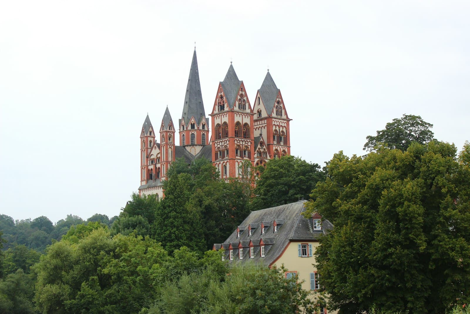 Limburg an der Lahn — a large building with two towers surrounded by trees