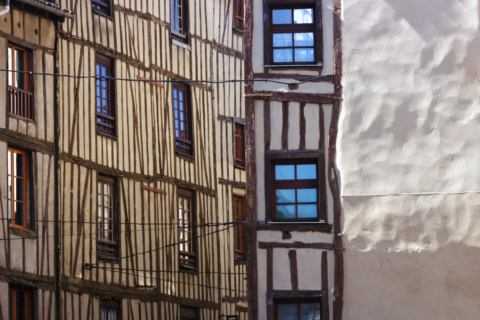 Limoges — brown concrete building with blue window