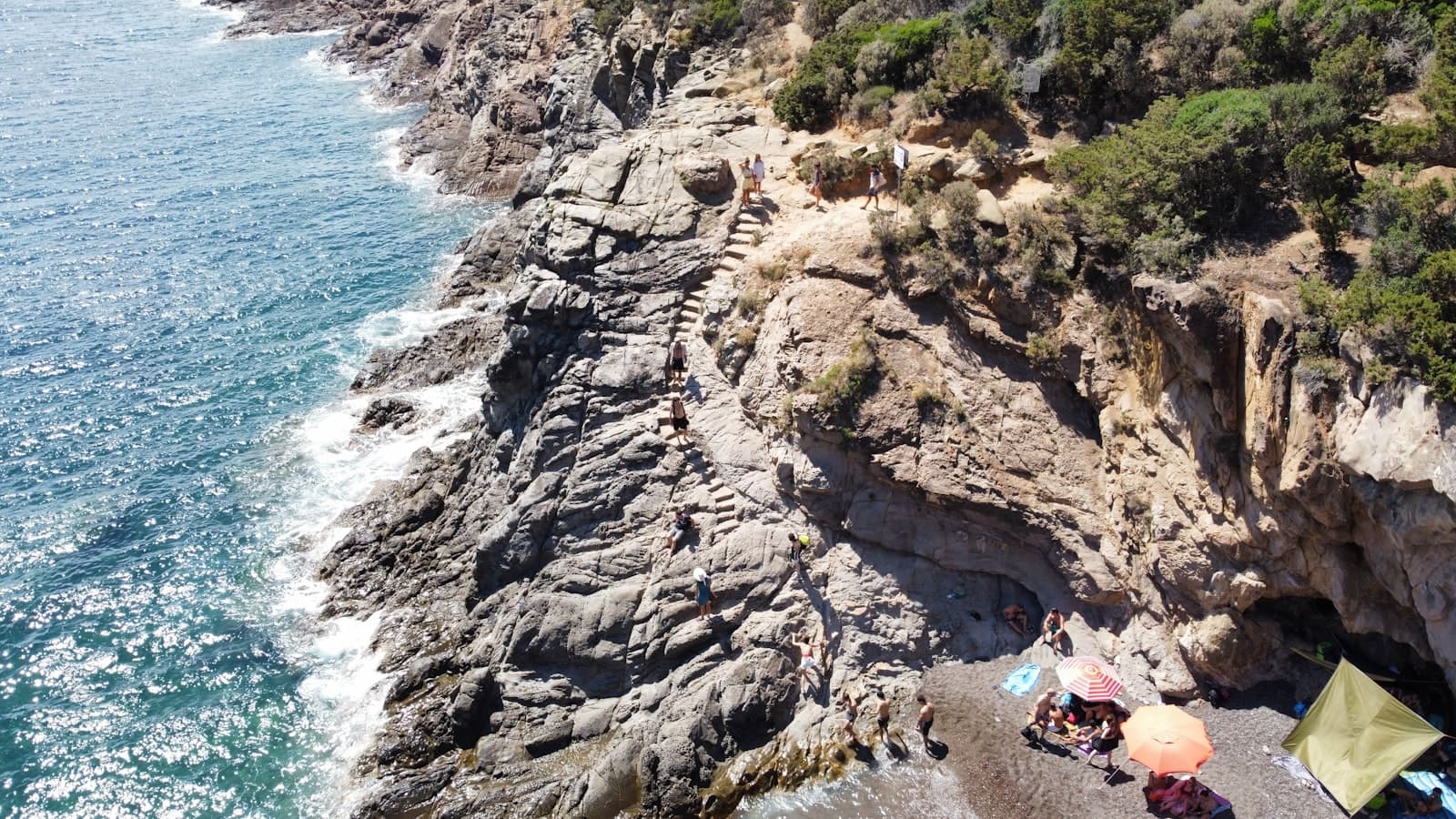 Livorno — a group of people on a rocky beach