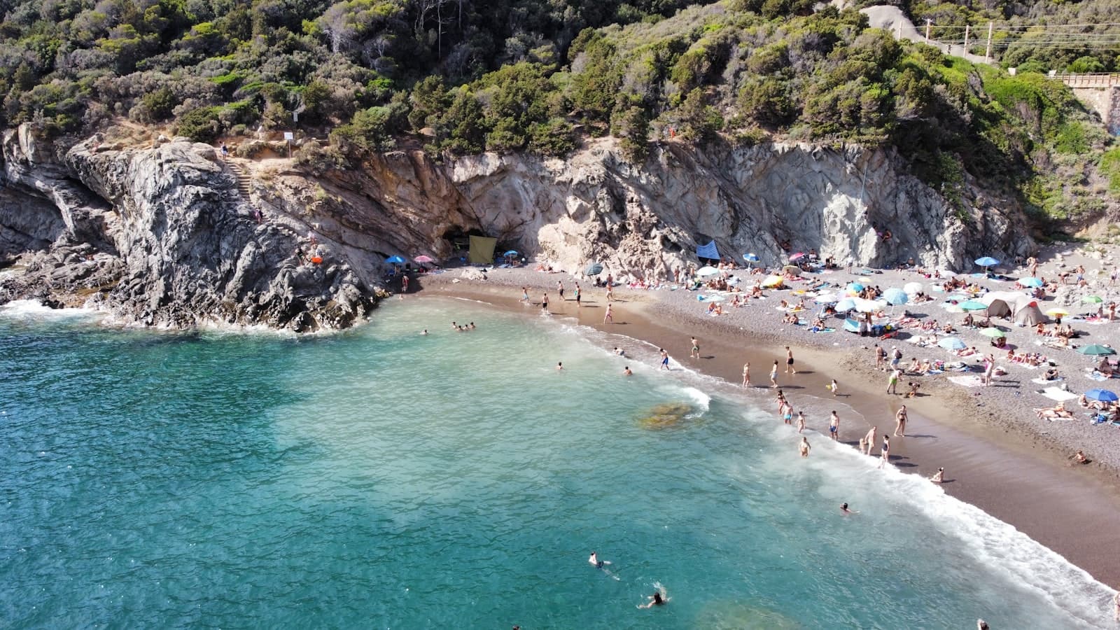 Livorno — a beach with people and rocks