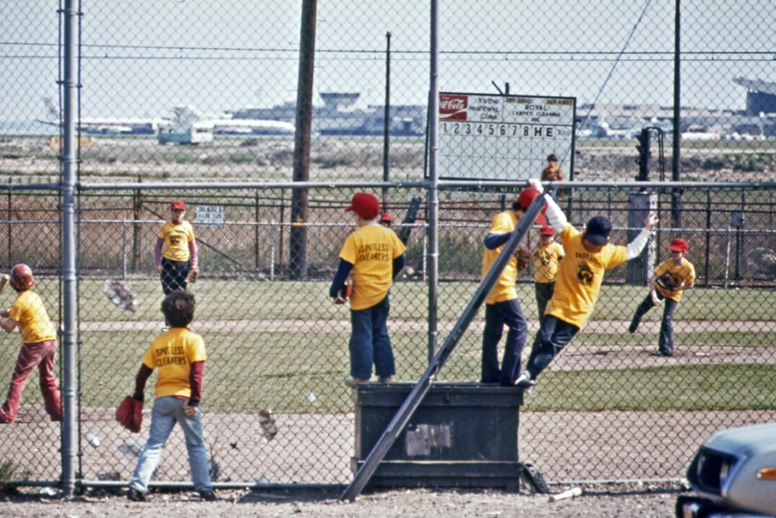 Logan — a group of young men standing on top of a baseball field