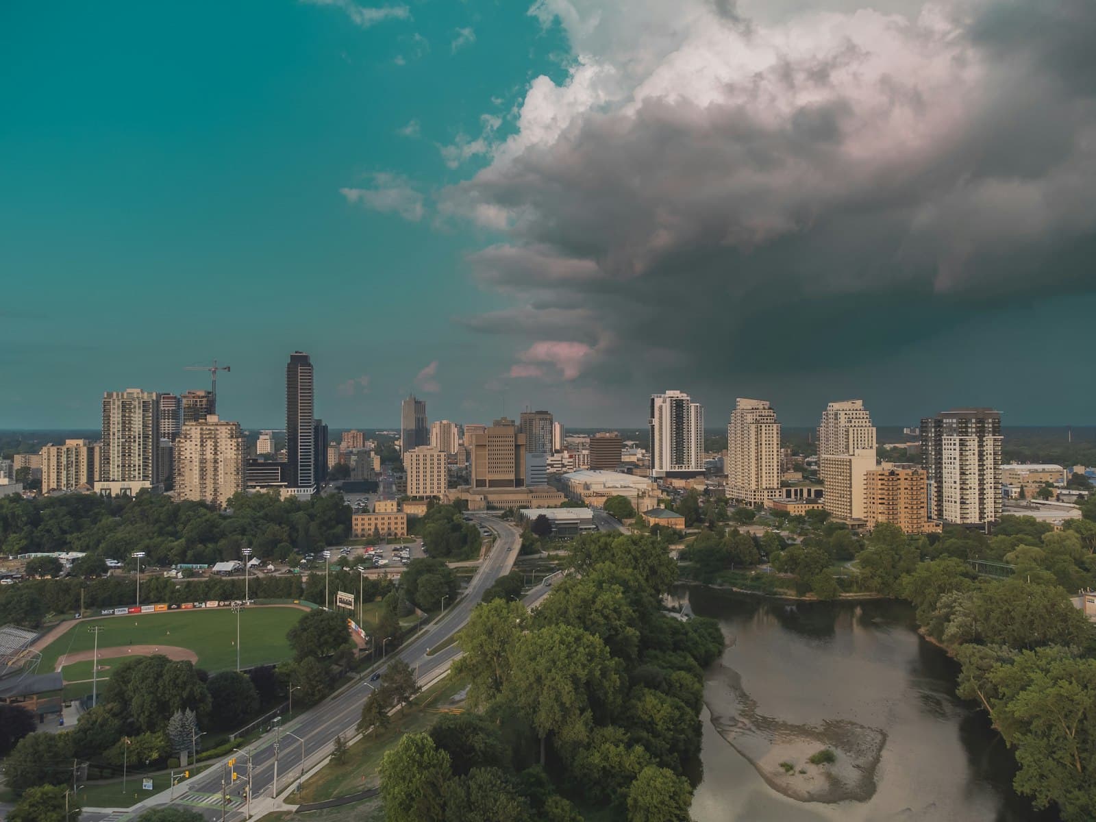 London — City skyline with dramatic clouds overhead.