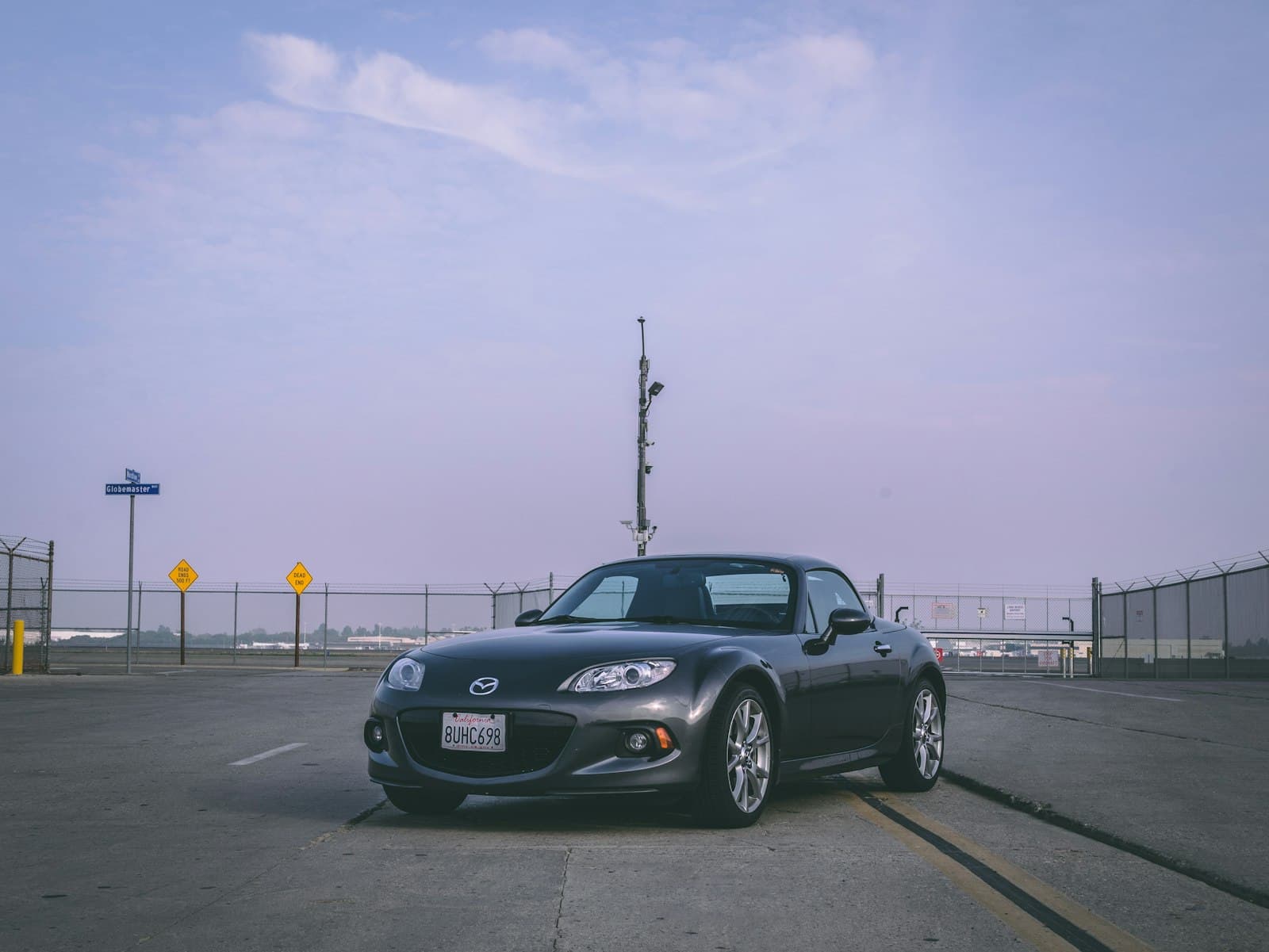 Long Beach — a black sports car parked in a parking lot