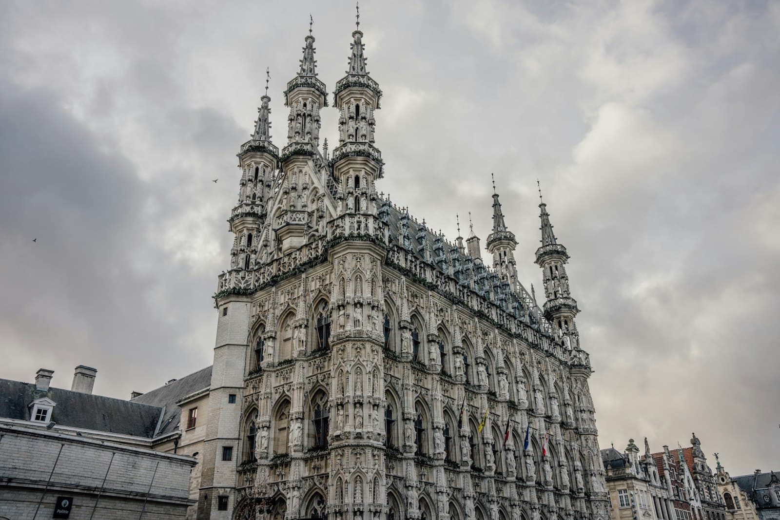 Leuven — a large building with many spires on top of it