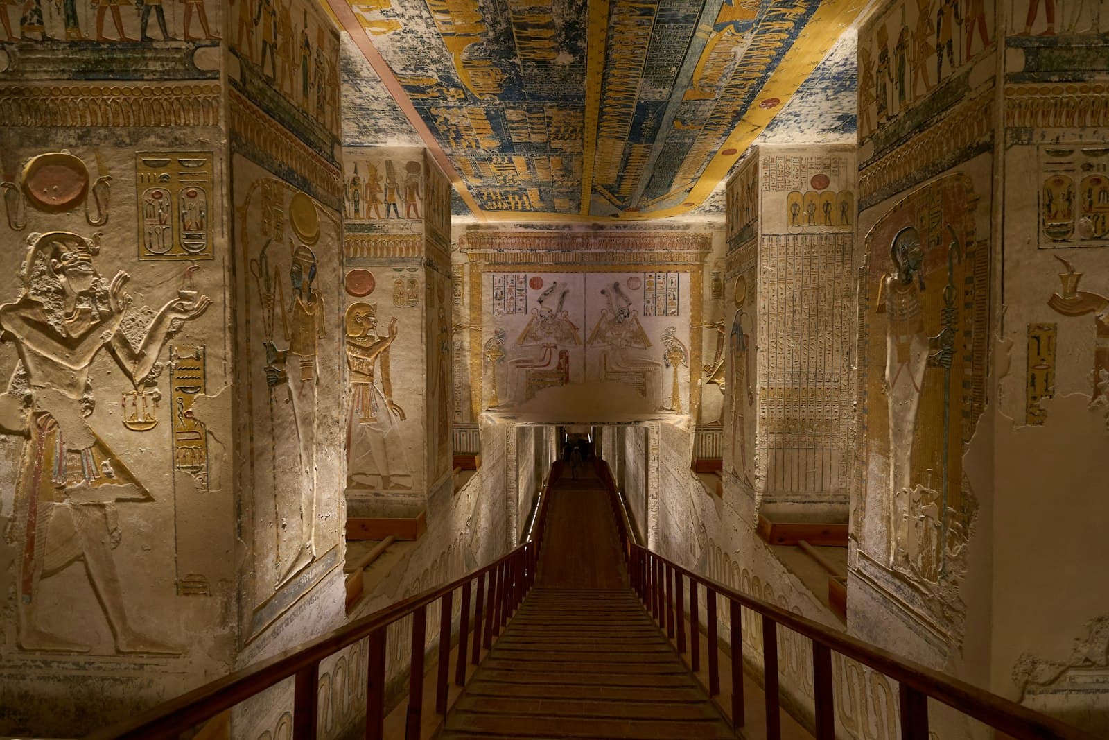 Luxor — a long hallway with paintings on the walls