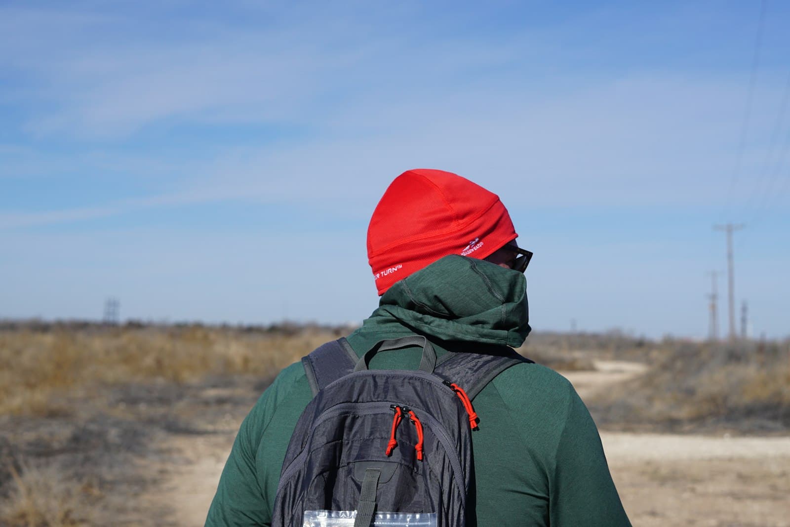 Lubbock — a person with a backpack on a dirt road