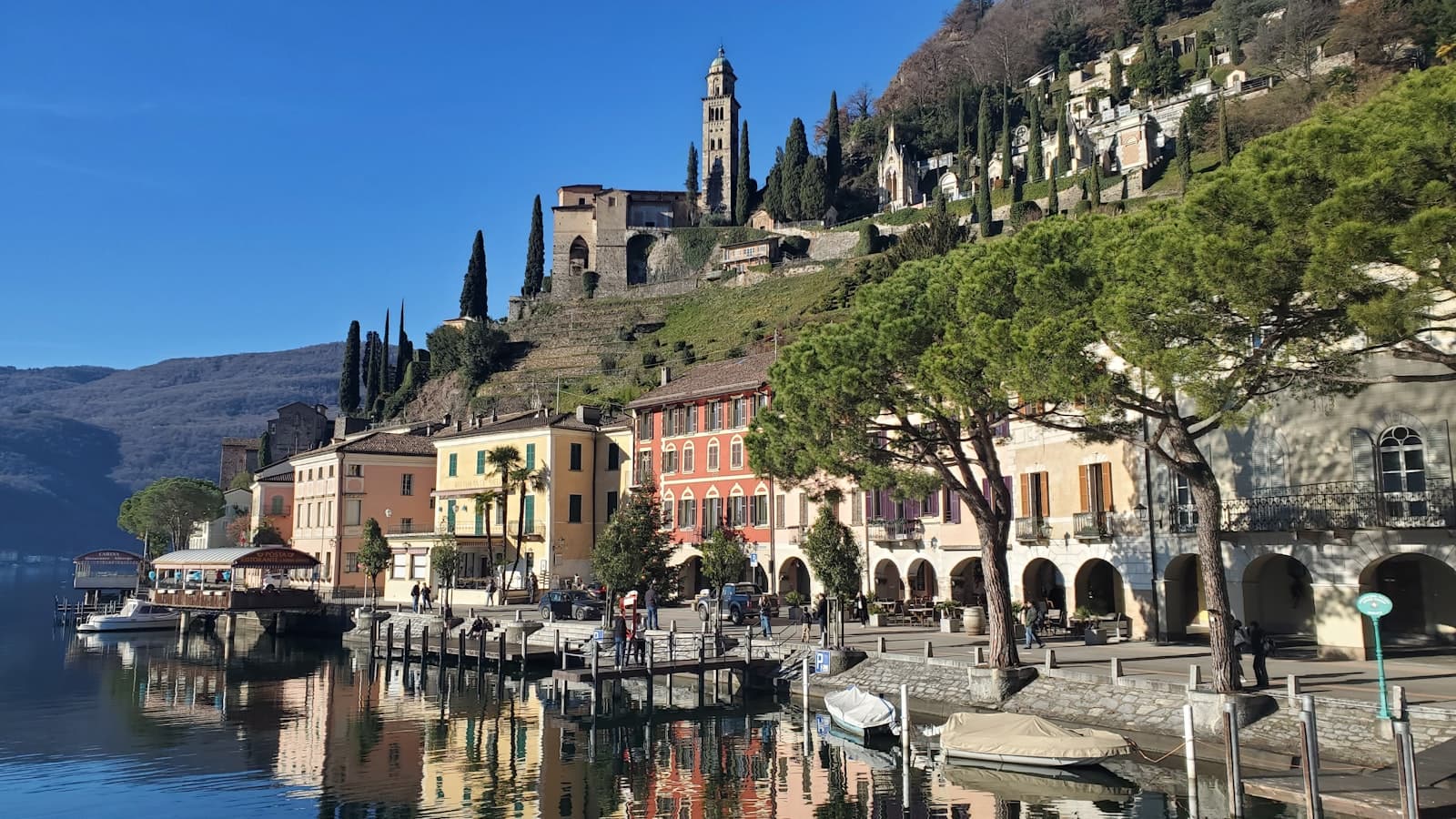 Lugano — a row of buildings next to a body of water