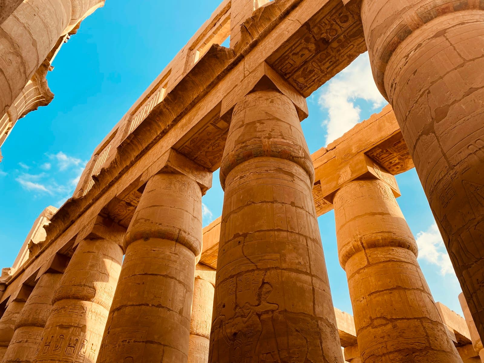 Luxor Temple — brown concrete pillars under blue sky during daytime