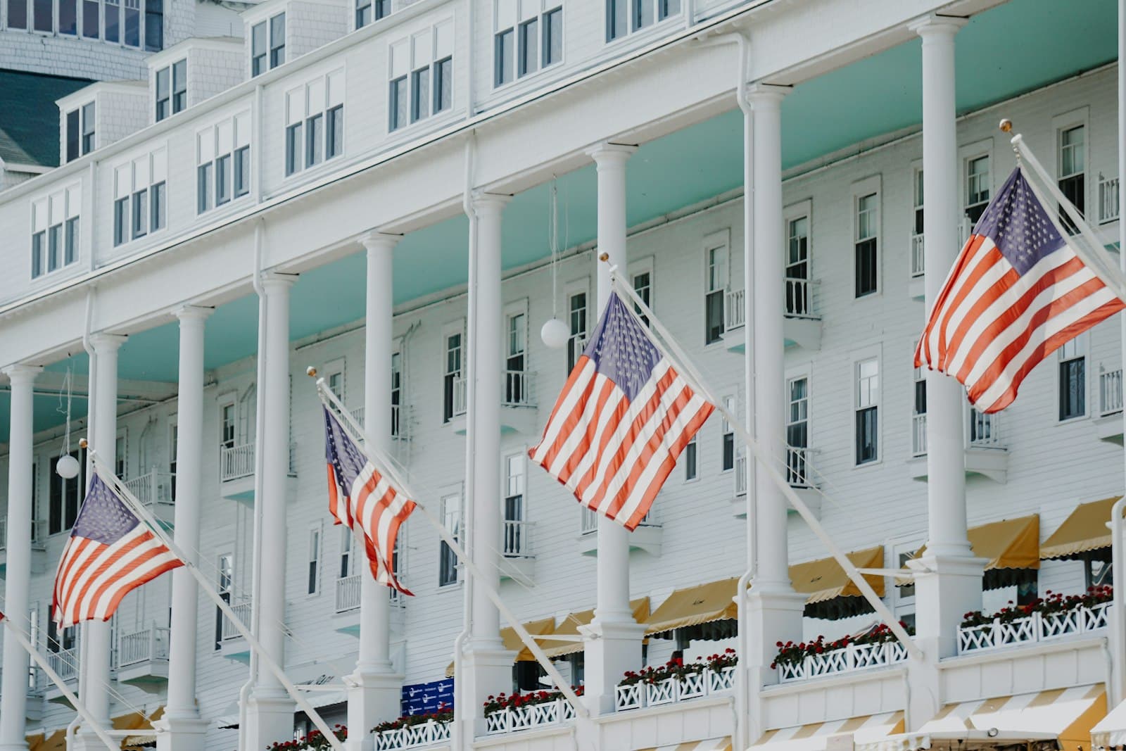 Mackinac Island — a row of american flags flying in front of a hotel
