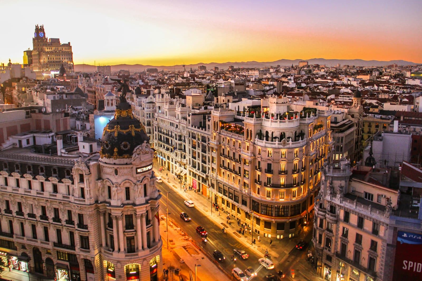 Madrid — aerial photography of vehicles passing between high rise buildings
