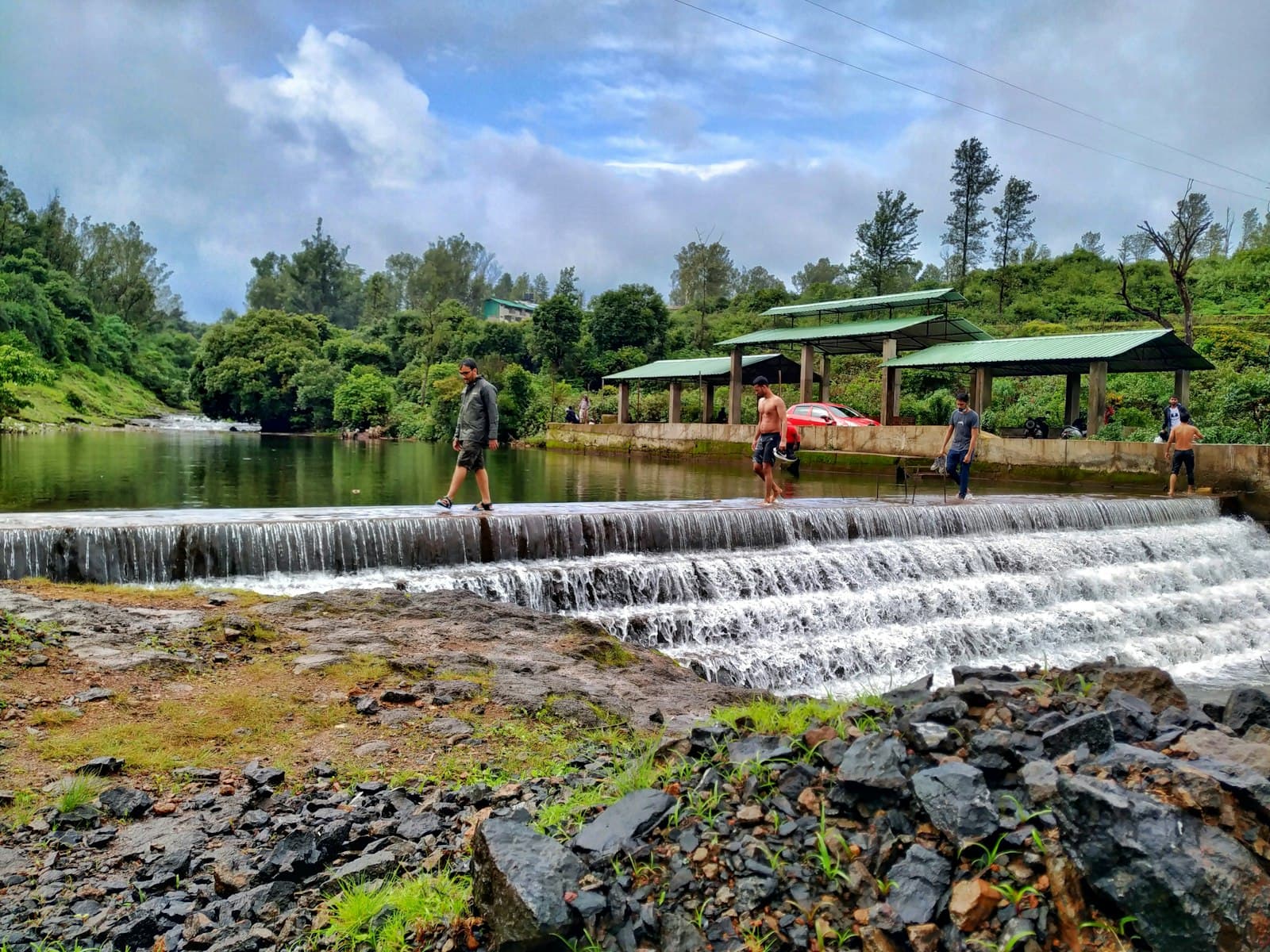Mahabaleshwar — people standing on rock near water falls during daytime