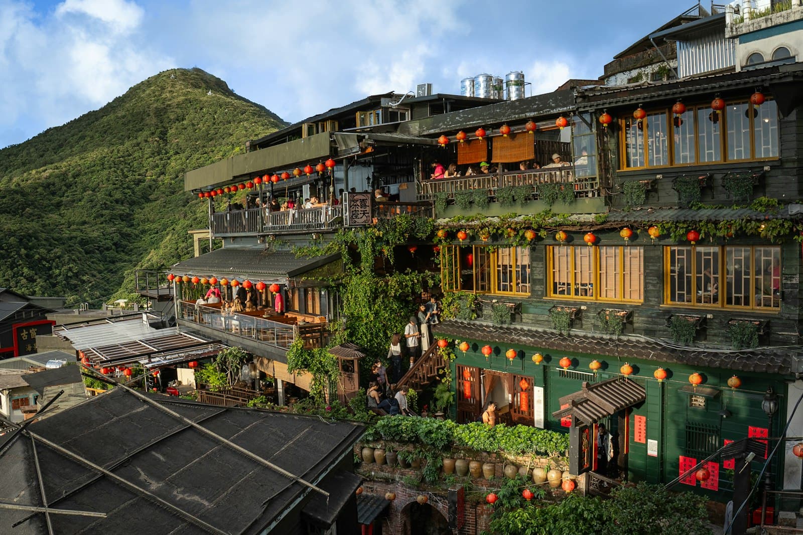Makung — A group of buildings with a mountain in the background