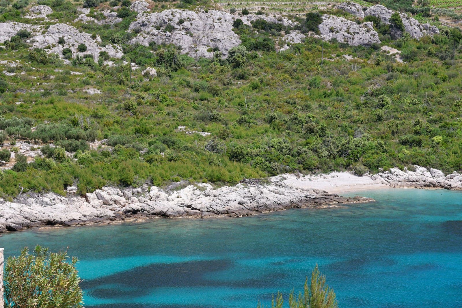 Mali Ston — a body of water surrounded by a lush green hillside