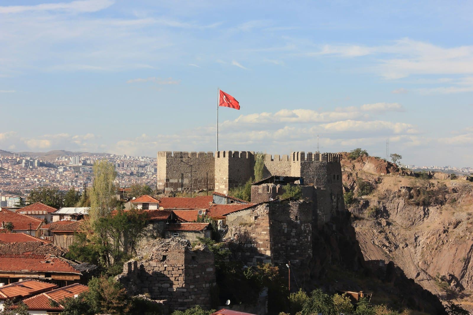 Manisa — A castle with a flag on top of it