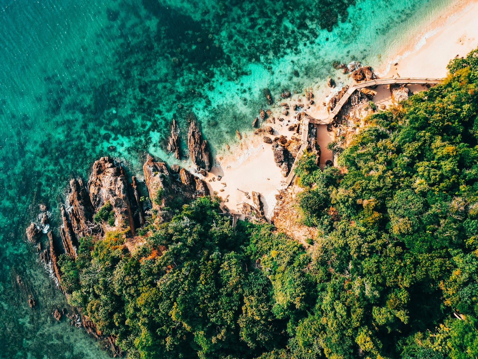 Marang — An aerial view of an island with a sandy beach
