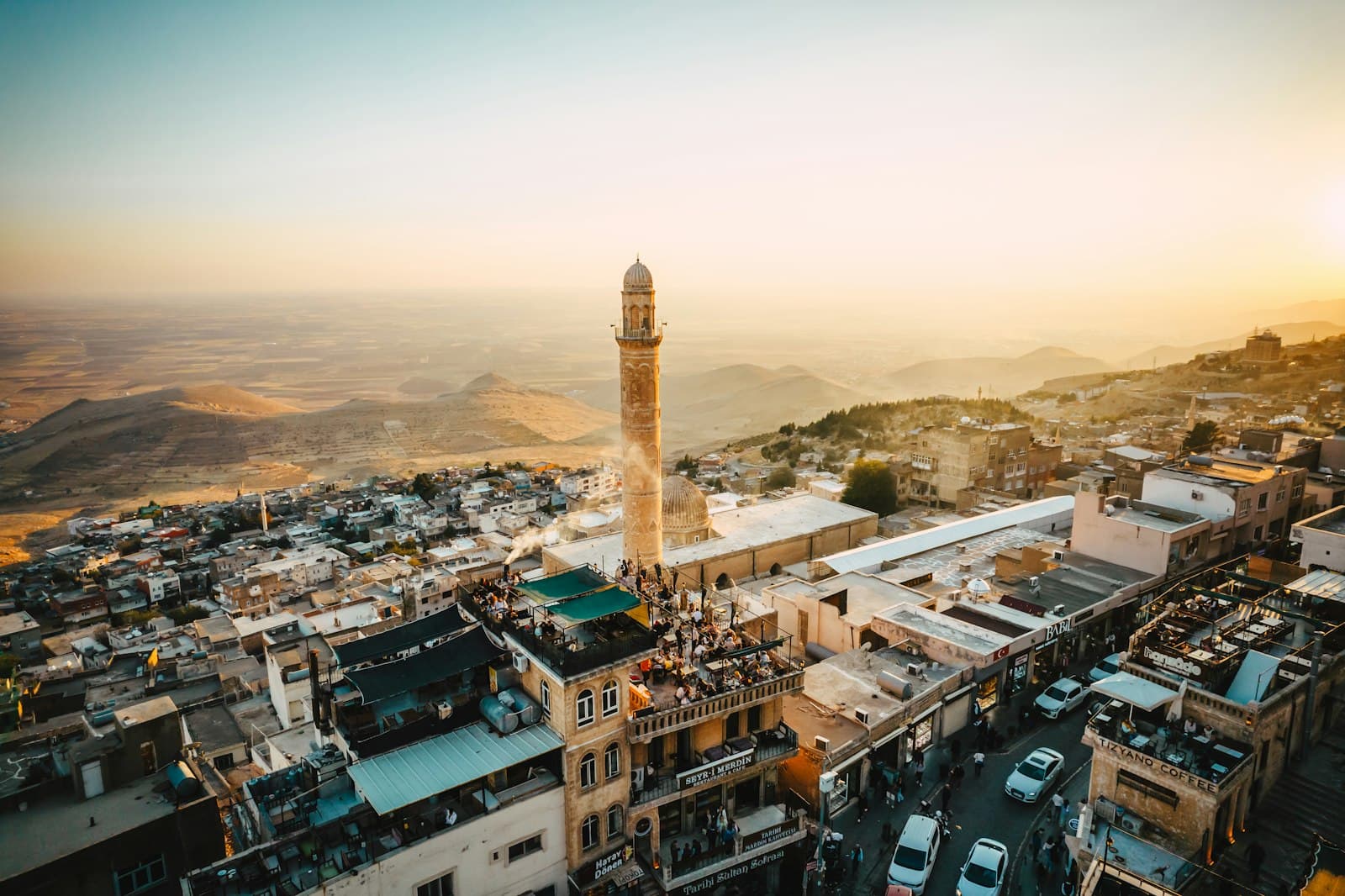 Mardin — A view of a city with a tall clock tower