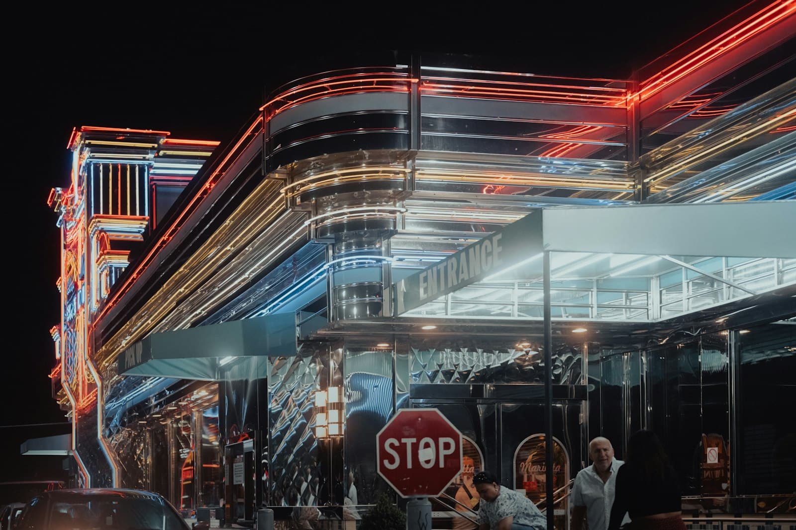 Marietta — a group of people standing outside of a building at night