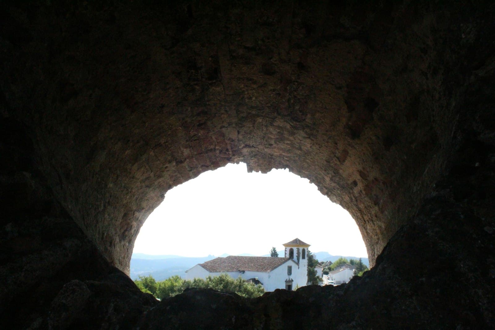 Marvão — brown concrete tunnel during daytime